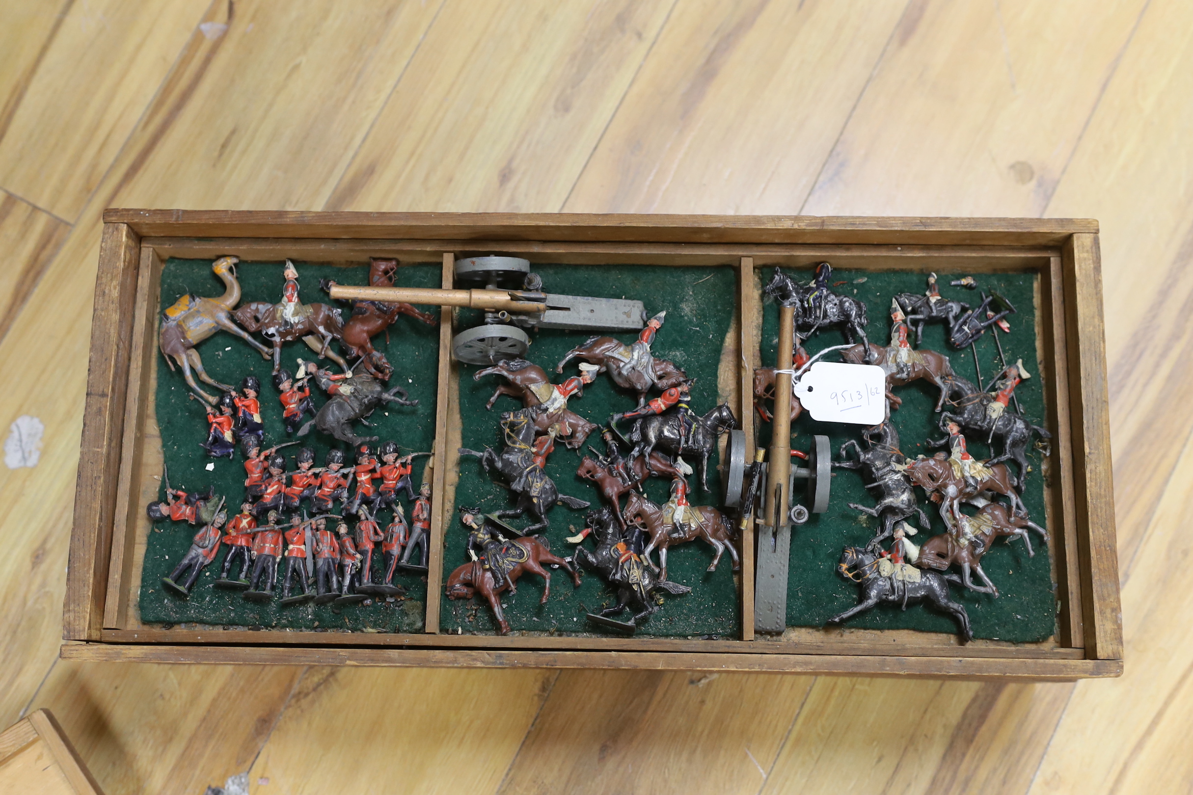 A childhood collection of Britains and other hollow-cast lead soldiers and two field guns, pre-war